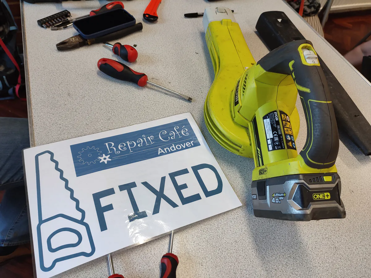 Repair Café volunteers working on electronics